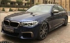 BMW 5 Series M550 (Negro), 2017 para alquiler en Dubai