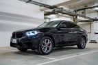 2020 BMW X4 with X4M Body Kit (Schwarz), 2020  zur Miete in Dubai 0