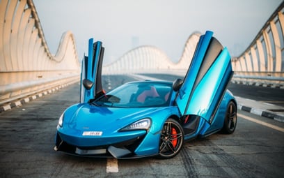 Blue McLaren 570S Spyder 2018 for rent in Dubai