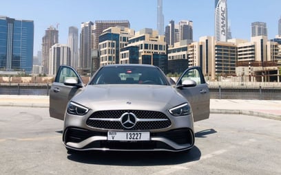 Grey Mercedes C 200 new Shape 2022 للإيجار في دبي