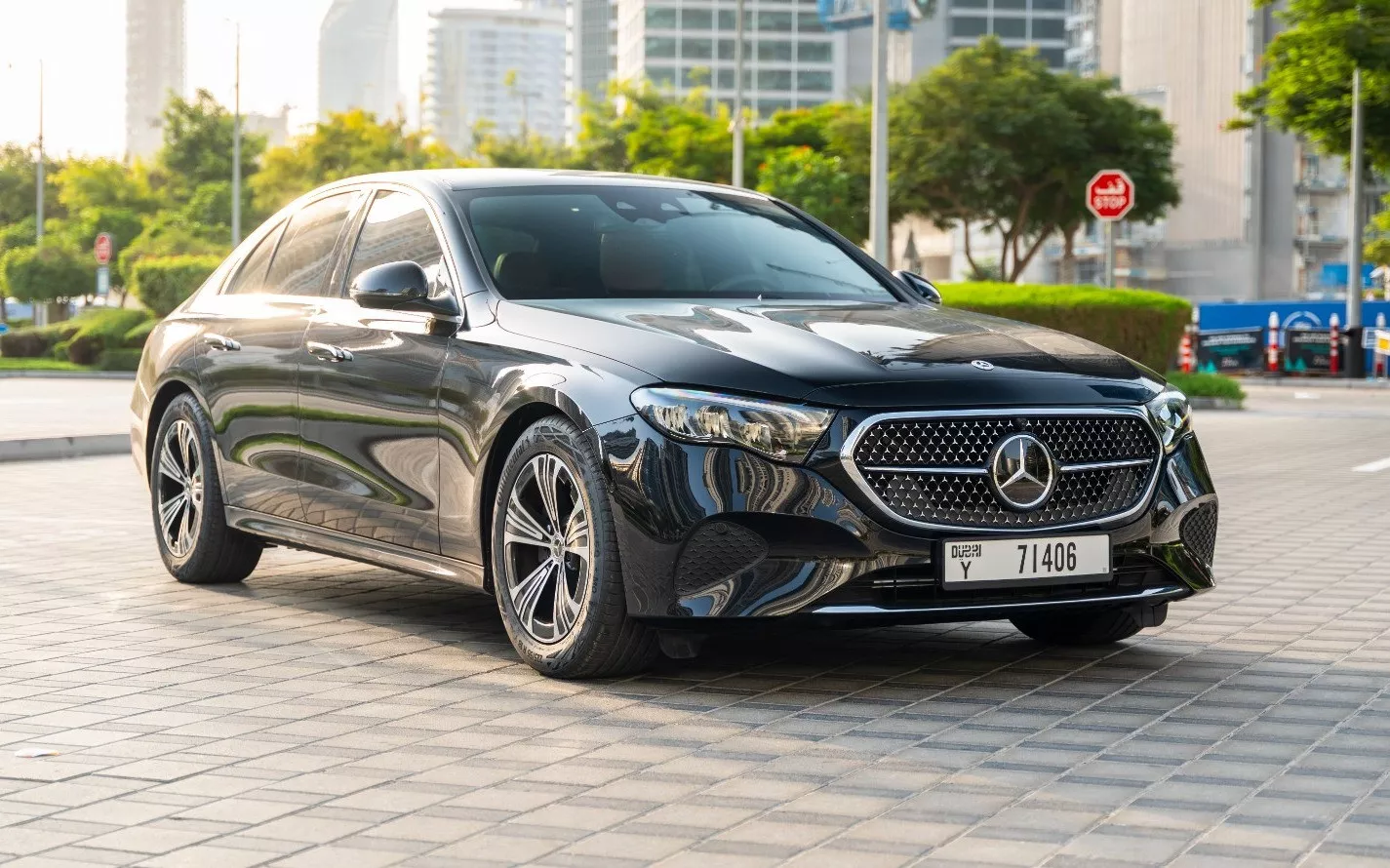 Mercedes E-Class sleek exterior parked in the city, representing a top choice for business car rental Dubai